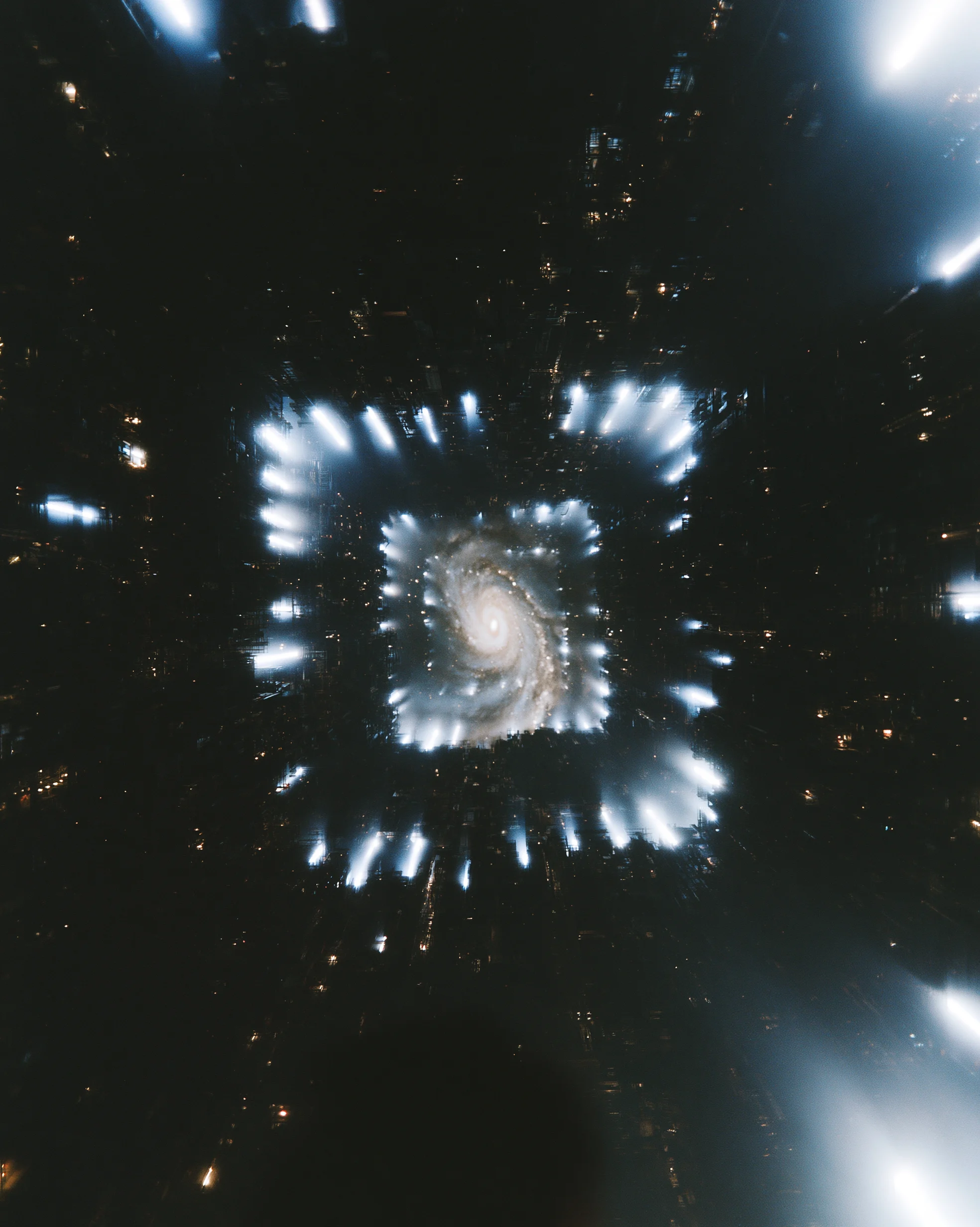A spiral galaxy at the centre of a square tunnel of city lights at night