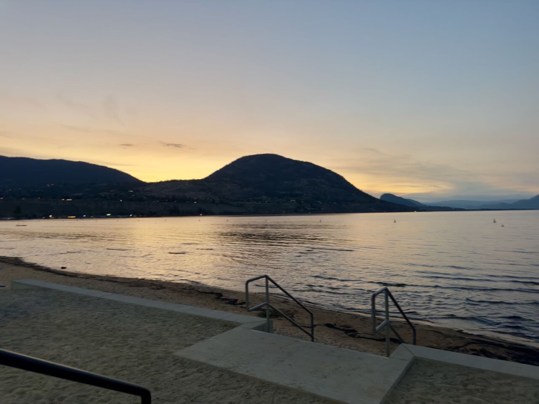 Sunset over the lake, mountain in silhouette